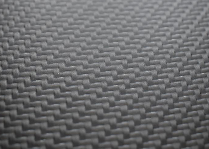 Carbon fibre leather material close-up showing texture and finish